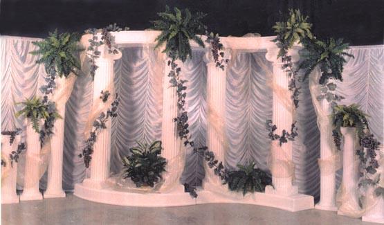 Roman Column Backdrop in an SShape design with climbing ivy and grapes