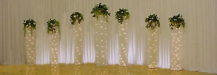 Lighted Chiffon Columns give an elegant backdrop to a wedding ceremony
