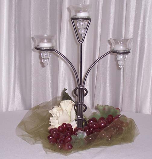 candle centerpiece can be decorated in various designs