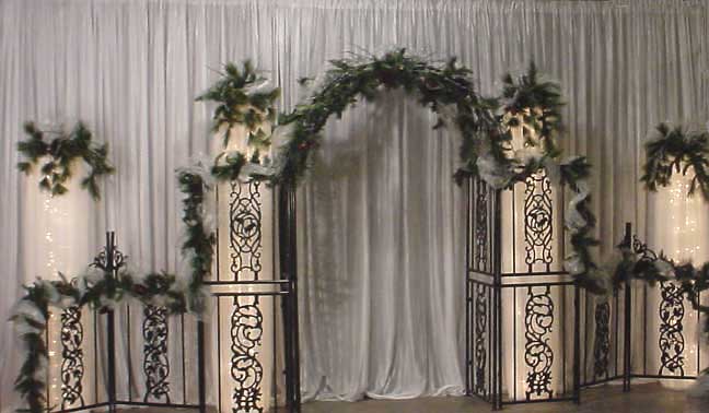  columns make a beautiful backdrop for your wedding Decorated with pine 