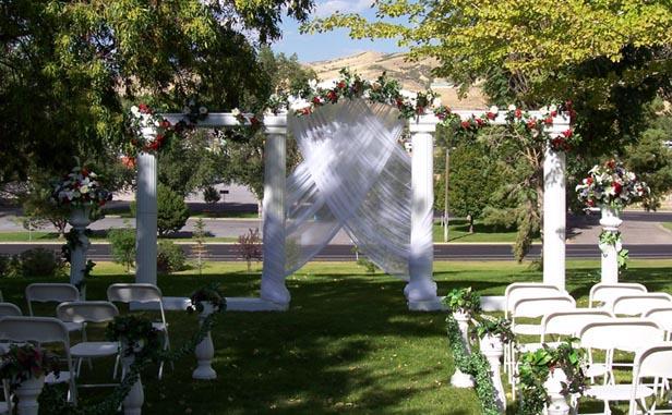 Grecian columns set up outside for a elegant outdoor wedding