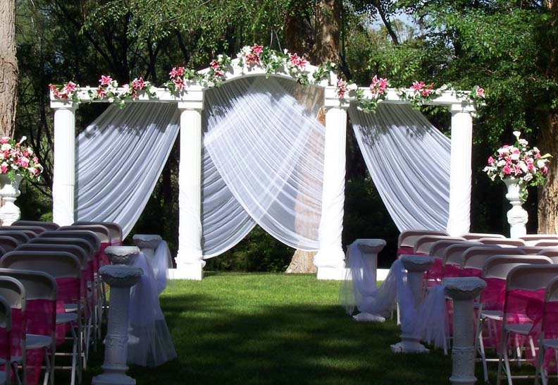 Outdoor Grecian Set with fuchsia florals and Chair Sash's on white chairs