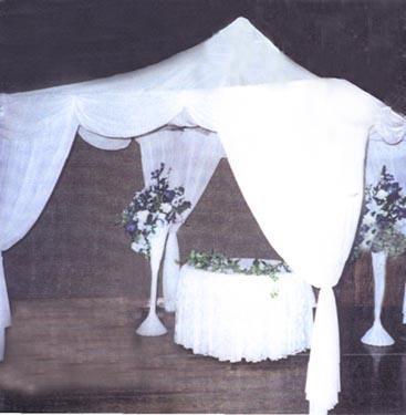 Top Gazebo Flowing satin curves can compliment an inside or outside wedding