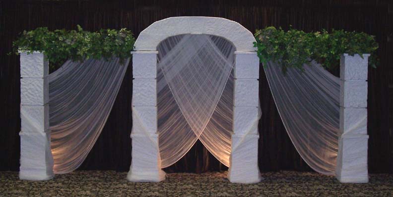 Square Grecian set with arch and crossing chiffon is a beautiful backdrop 