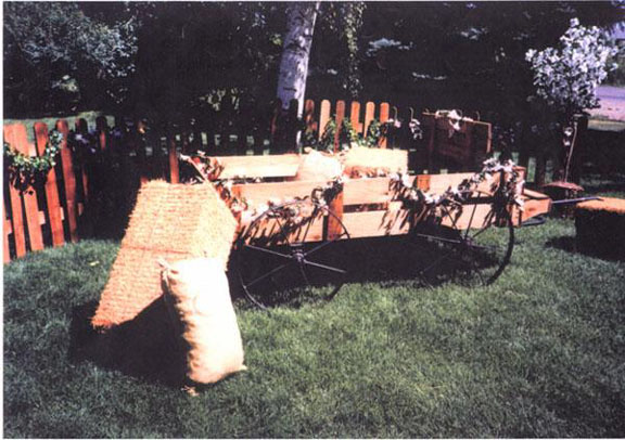 western wedding Accented with cedar fence and artificial hay bales and feed